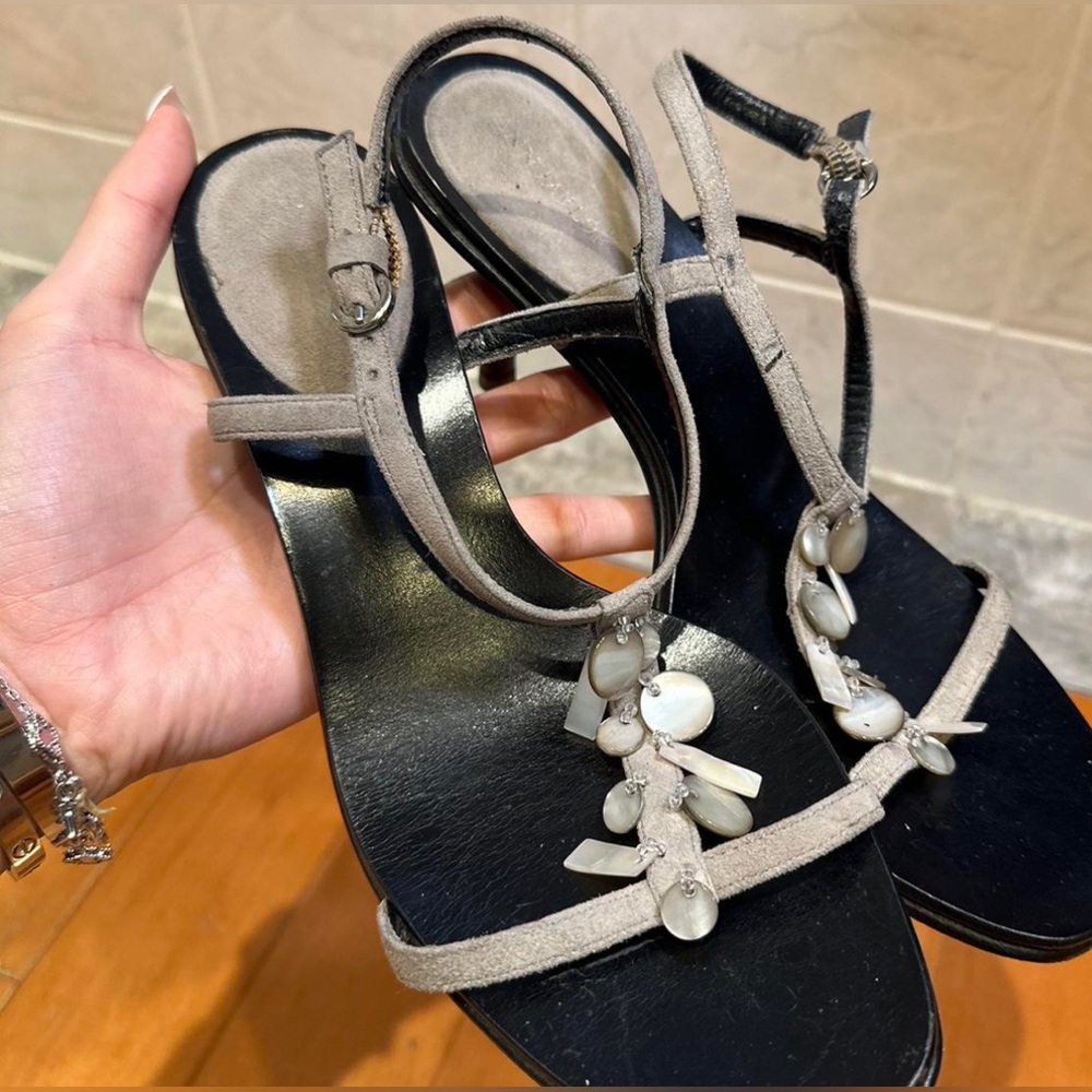 Black and gray strap he sandals with Opal charms on the front.